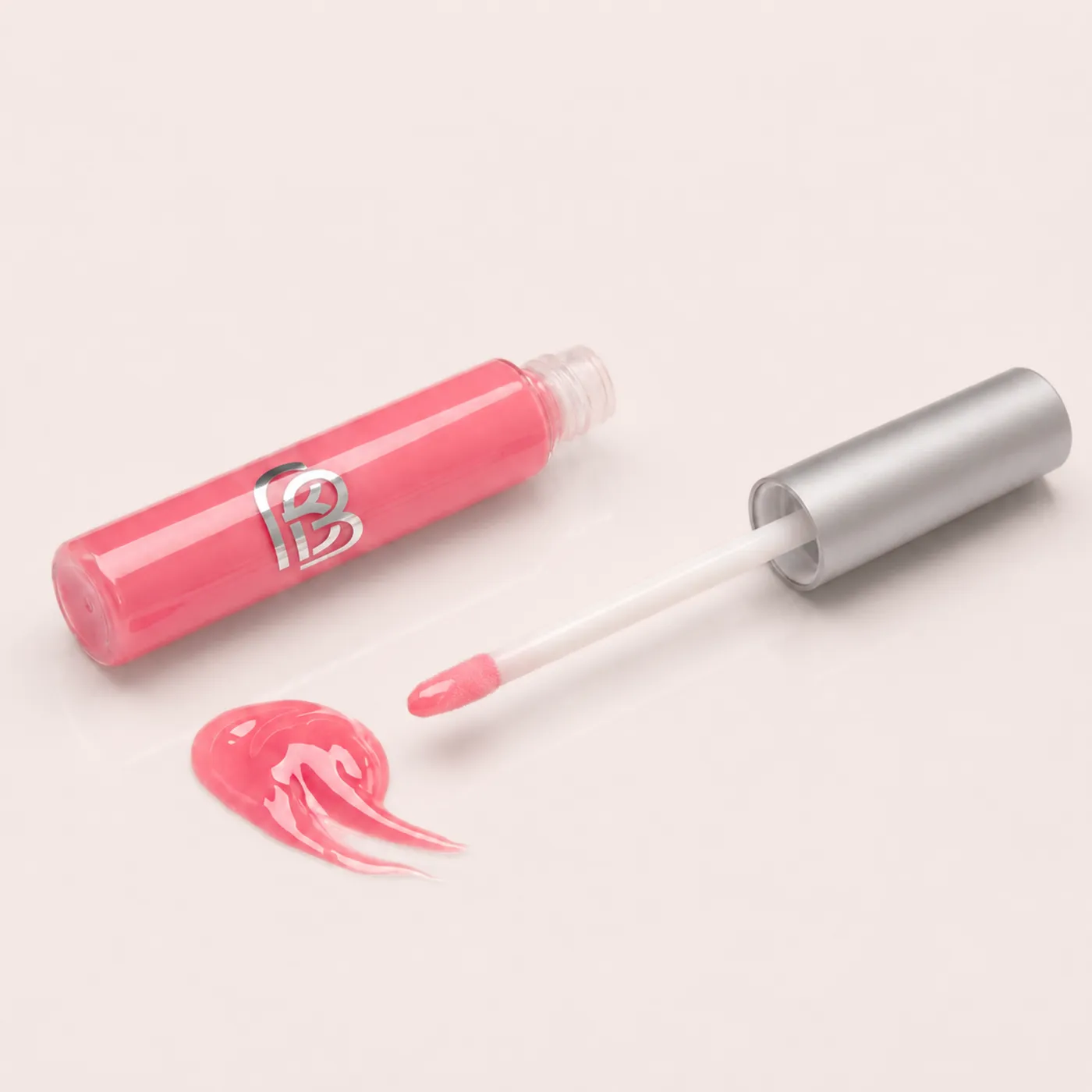 Natural Vegan Lip Gloss tube with its wand and a swatch of pink gloss